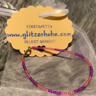 Armband mit kleinen Glasperlen lila-rosa